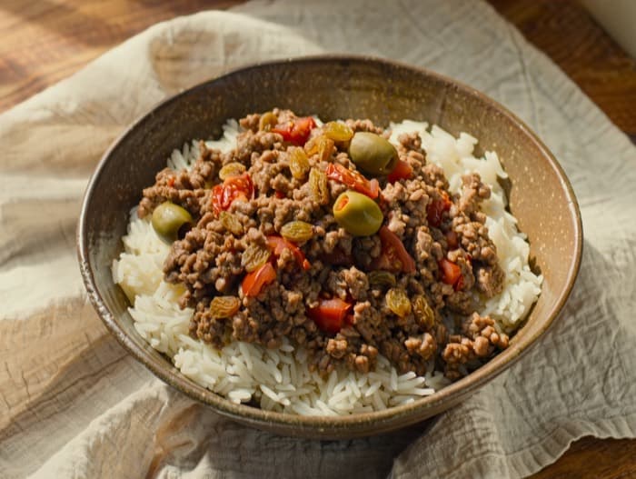 Beef Picadillo over Rice, plated and ready to serve