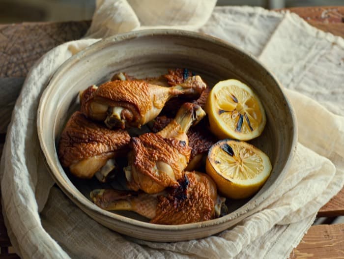 Broiled Paprika Chicken with Charred Lemon, plated and ready to serve