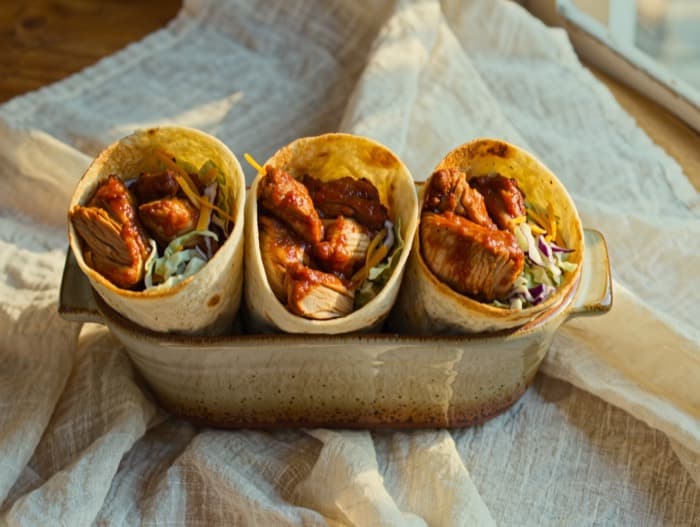 Buffalo Chicken Wraps with Ranch Slaw, plated and ready to serve