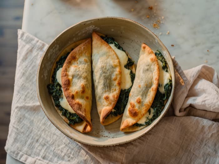 Cheesy Spinach Calzone Pockets, plated and ready to serve
