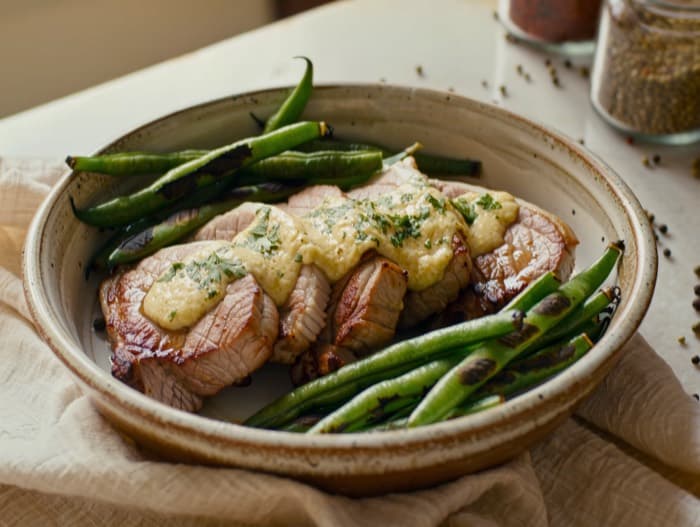 Broiled Garlic Butter Pork Chops, plated and ready to serve