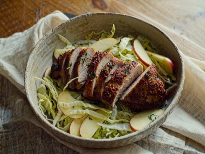 Broiled Pork Tenderloin with Apple Slaw, plated and ready to serve
