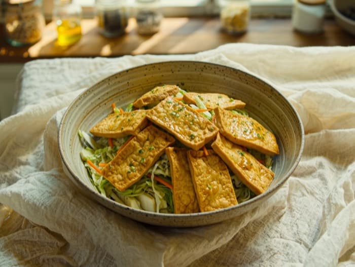 Crunchy Peanut Cabbage and Tofu Bowls, plated and ready to serve