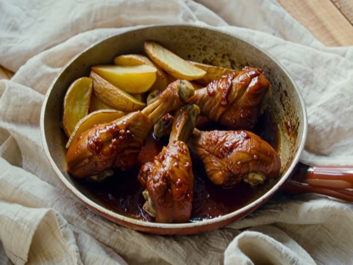 Oven BBQ Drumsticks with Potato Wedges, plated and ready to serve