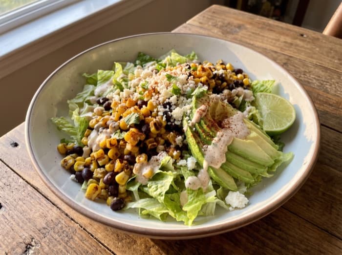 Street Corn and Black Bean Bowls, plated and ready to serve