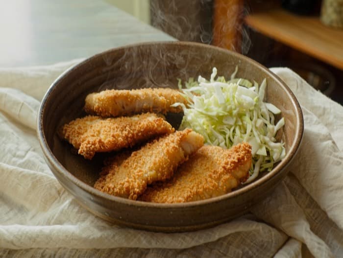 Oven-Fried Cornmeal Tilapia, plated and ready to serve