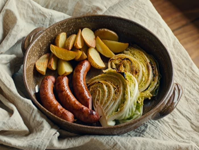 Kielbasa, Potato, and Cabbage Sheet Pan, plated and ready to serve