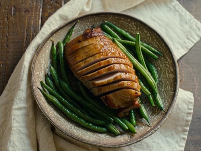 Sheet-Pan Pork Tenderloin with Green Beans, plated and ready to serve