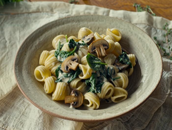 Creamy Spinach and Mushroom Pasta, plated and ready to serve