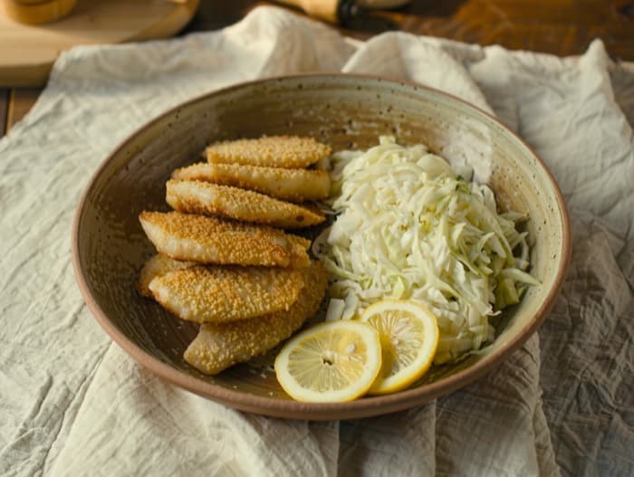 Cornmeal-Crusted Tilapia with Slaw, plated and ready to serve